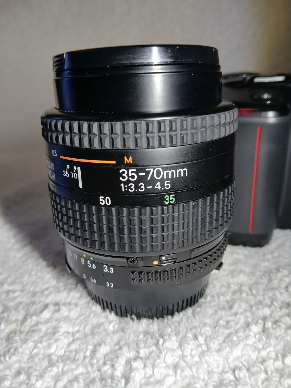 Nikon N6006 35mm autofocus SLR film camera. With Extra Lens and 2 Rolls Of Film.